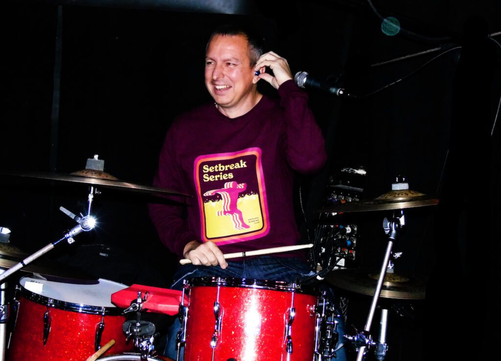 Assisi Style owner Greg on drums