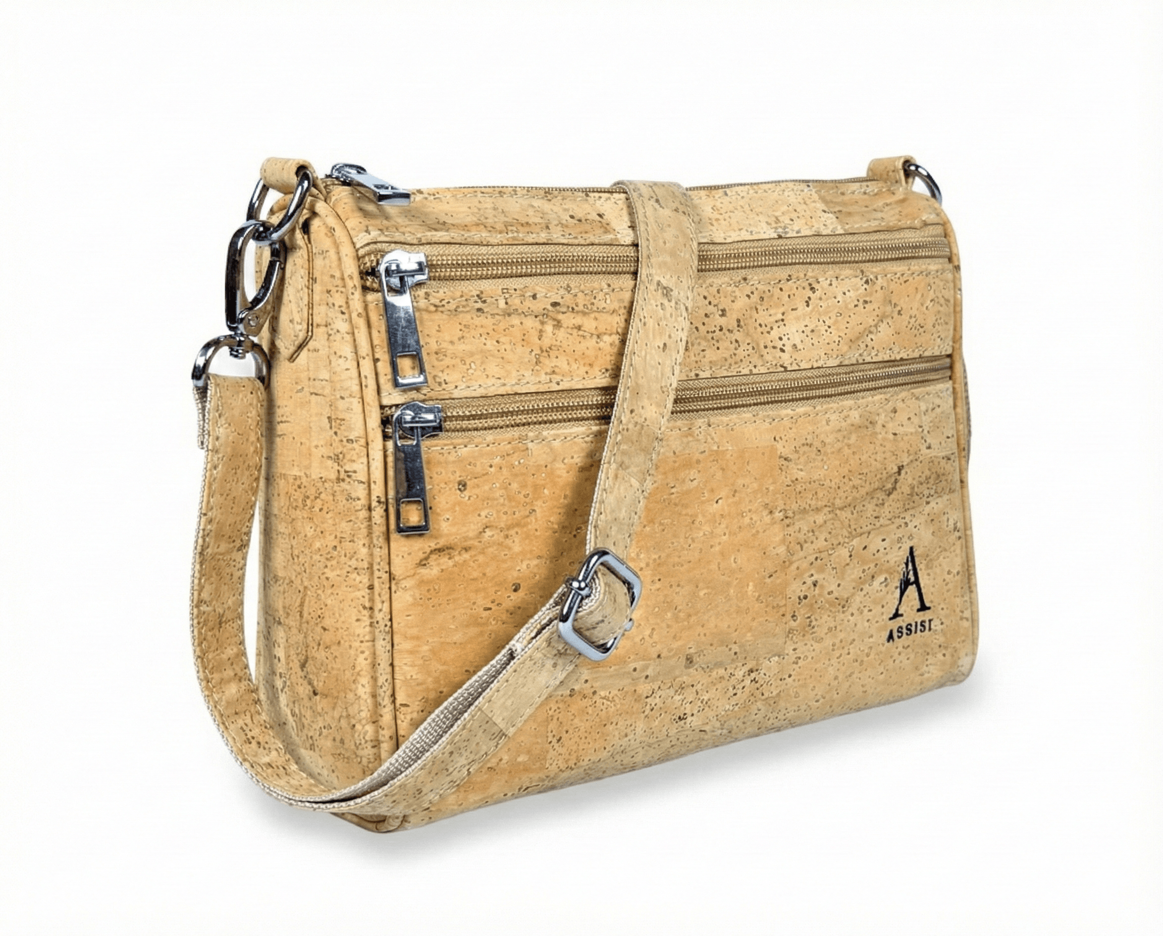 Beige cork-textured handbag with multiple zippers and a shoulder strap photographed on white background