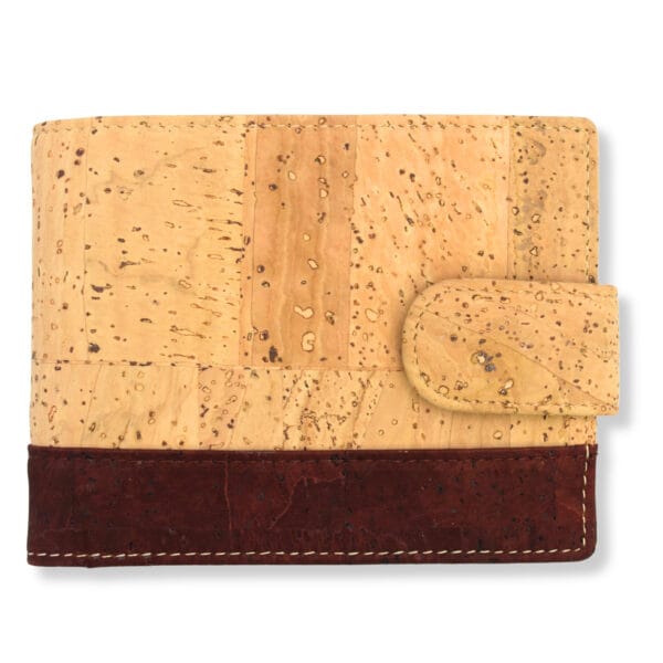 Beige cork-patterned sofa upholstery with a dark brown leather base visible at the bottom edge.